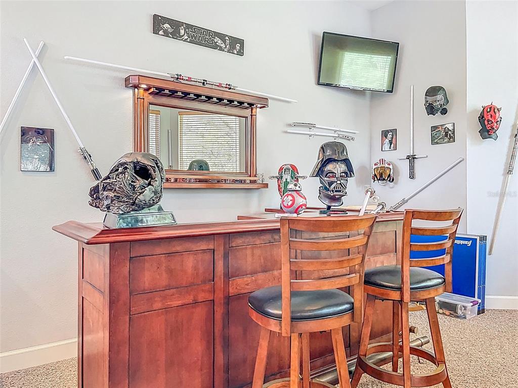 414 Westgate Road Tarpon Springs, FL 34688 - Photo 45 of 75 a view of a dining room with furniture and chandelier