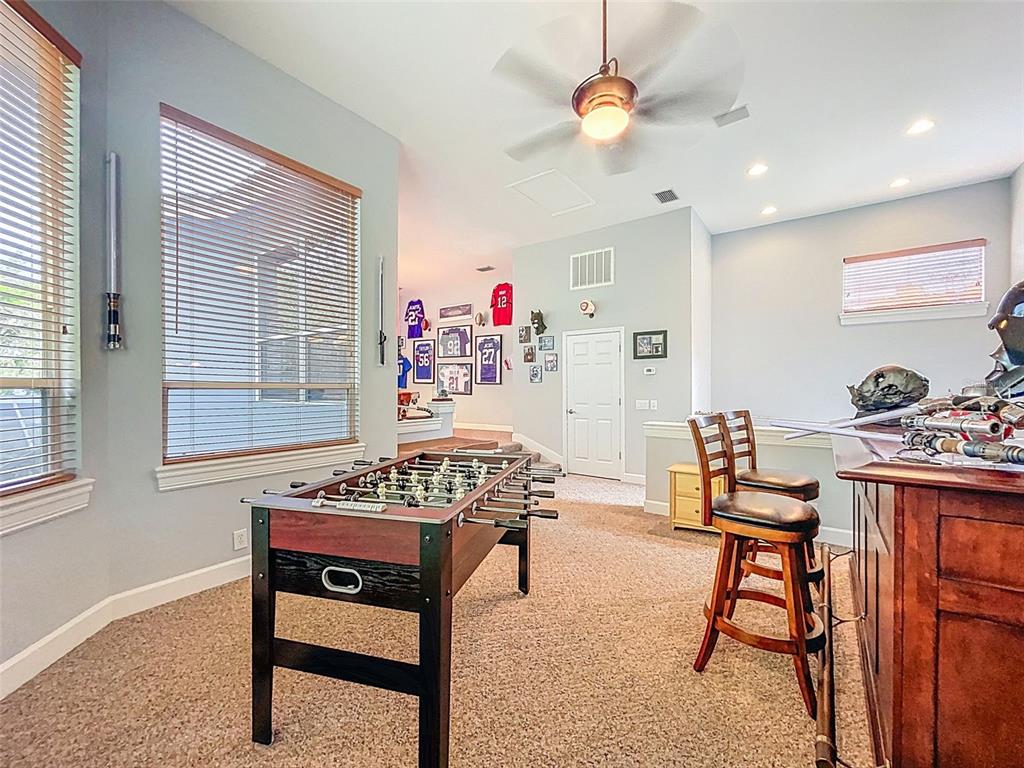 414 Westgate Road Tarpon Springs, FL 34688 - Photo 46 of 75 a view of a workspace with furniture and a window