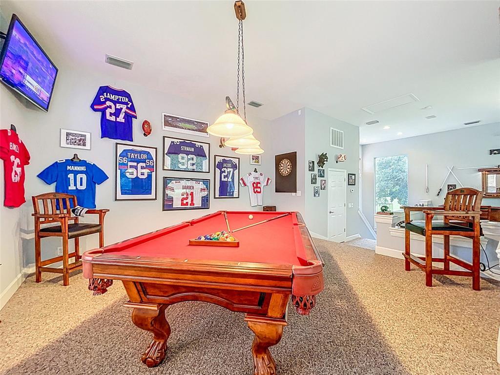414 Westgate Road Tarpon Springs, FL 34688 - Photo 48 of 75 a room with furniture pool table and windows