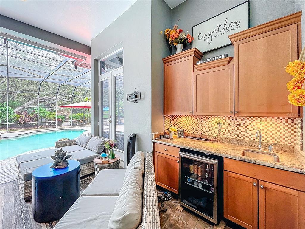 414 Westgate Road Tarpon Springs, FL 34688 - Photo 51 of 75 a living room with furniture and a gate