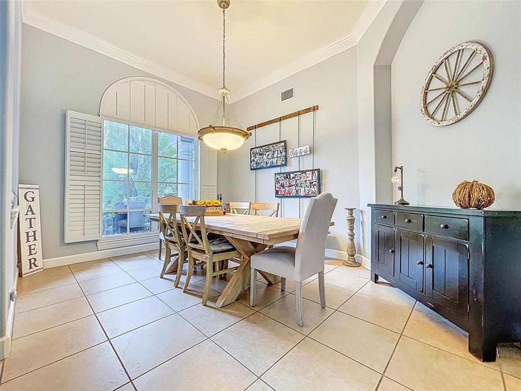 414 Westgate Road Tarpon Springs, FL 34688 - Photo 8 of 75 a view of a dining room with furniture window and outside view