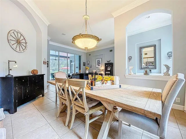 a bedroom with a large bed a flat tv screen and dresser