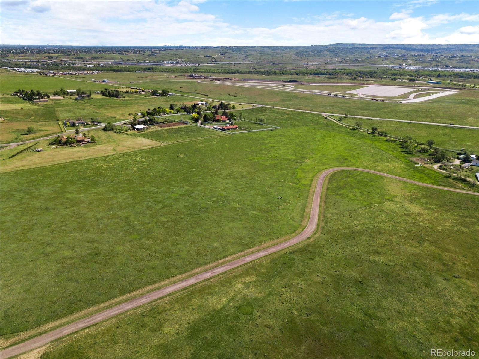 8045 North Moore Road Littleton, CO 80125 - Photo 10 of 17 a view of a lake with a outdoor space