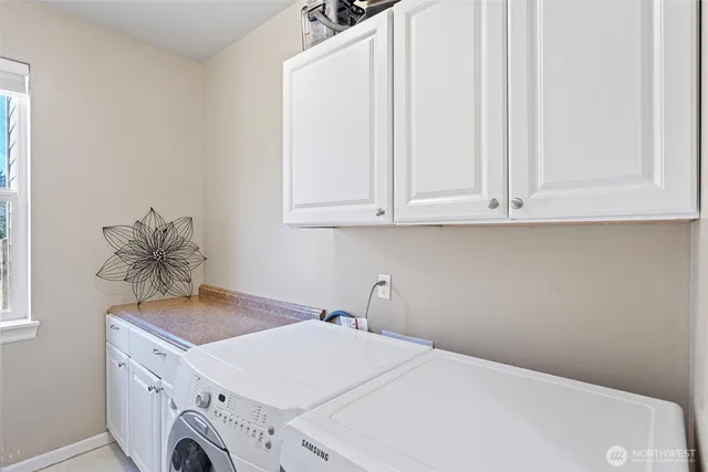 a bathroom with a sink and cabinets
