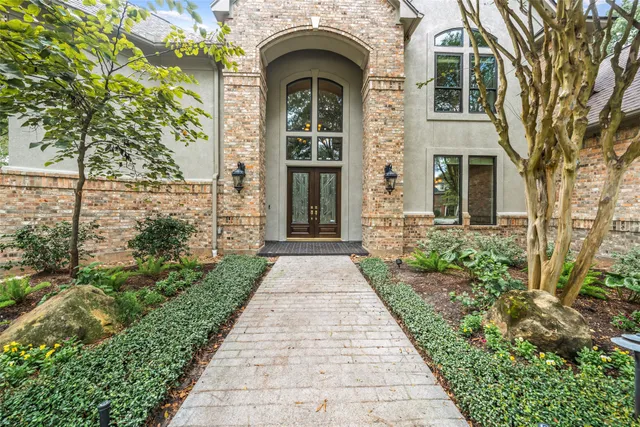 a view of an entryway with wooden floor and door