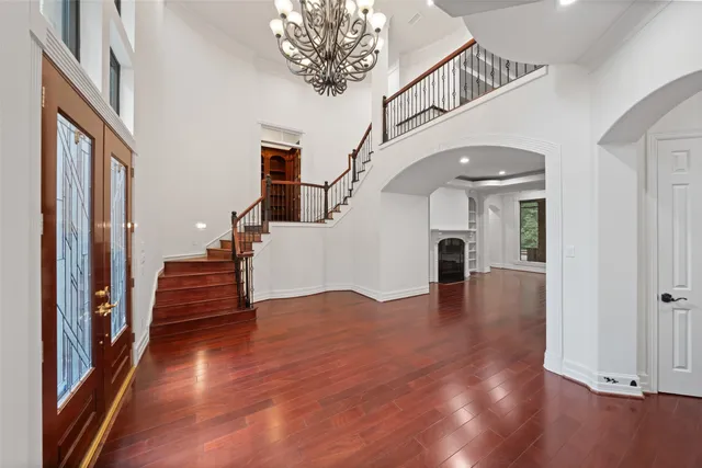 a living room with furniture fireplace and a large window