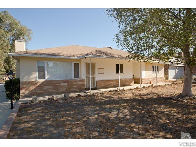 4361 Adam Road Simi Valley, CA 93063 - Photo 1 of 12 a backyard of a house with large trees