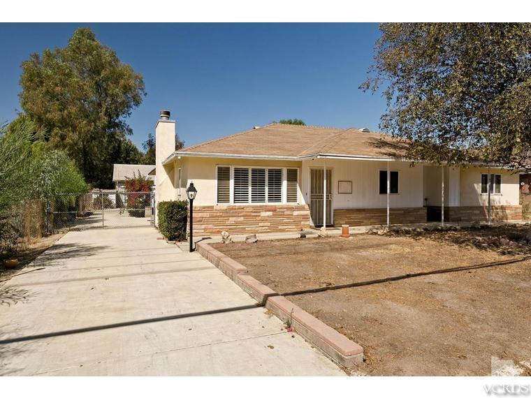 4361 Adam Road Simi Valley, CA 93063 - Photo 2 of 12 a front view of a house with a garden
