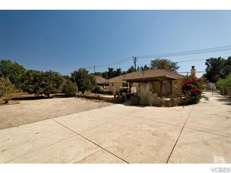 4361 Adam Road Simi Valley, CA 93063 - Photo 12 of 12 a front view of a house with a yard and garage