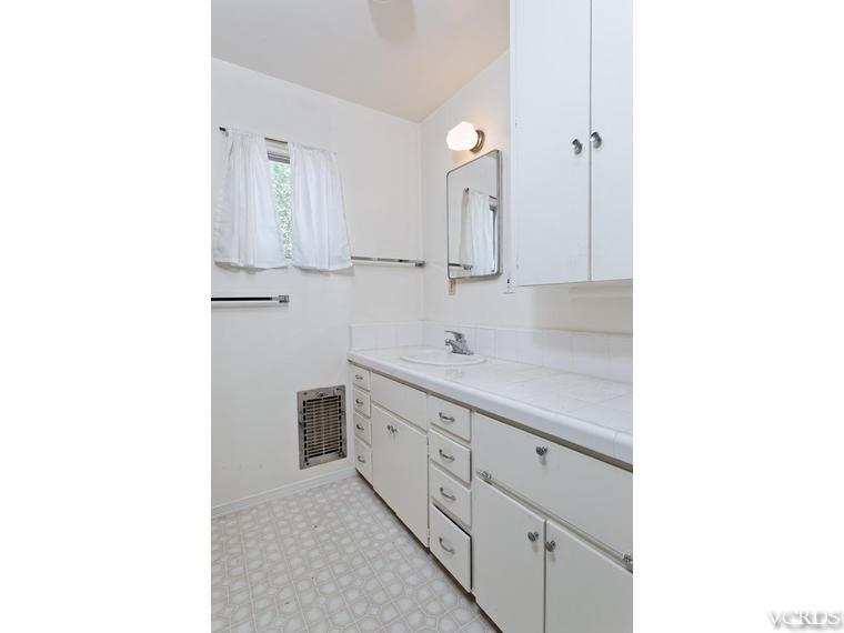4361 Adam Road Simi Valley, CA 93063 - Photo 8 of 12 a bathroom with a sink and a mirror