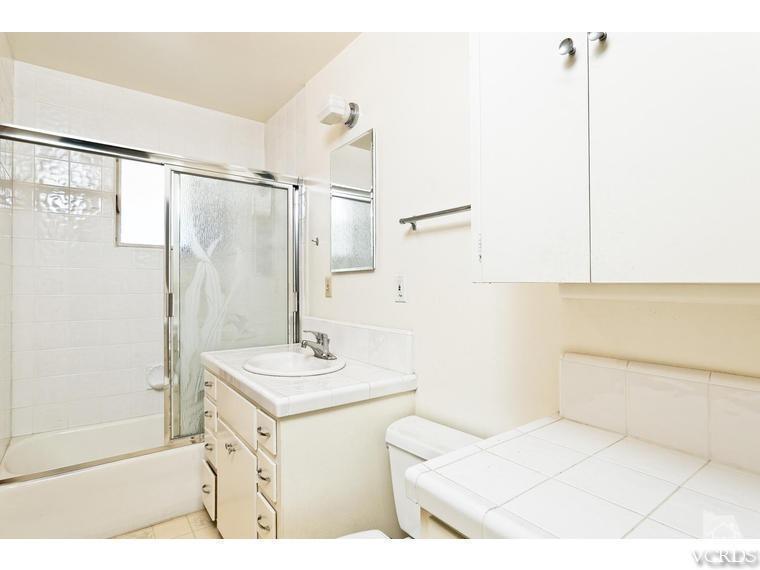 4361 Adam Road Simi Valley, CA 93063 - Photo 9 of 12 a bathroom with a sink a toilet and shower