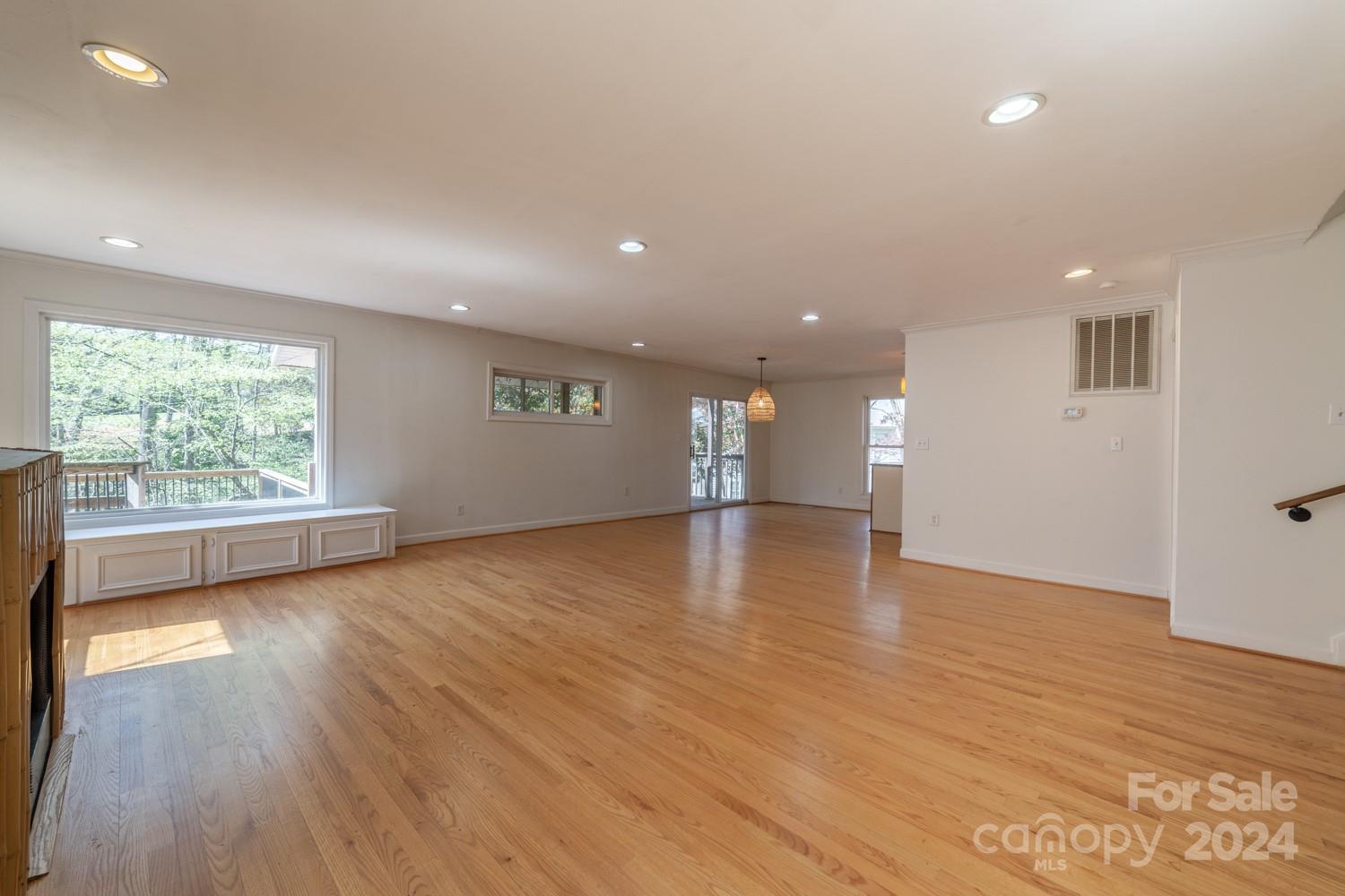 1177 Molokai Drive Tega Cay, SC 29708 - Photo 12 of 41 an empty room with wooden floor and windows