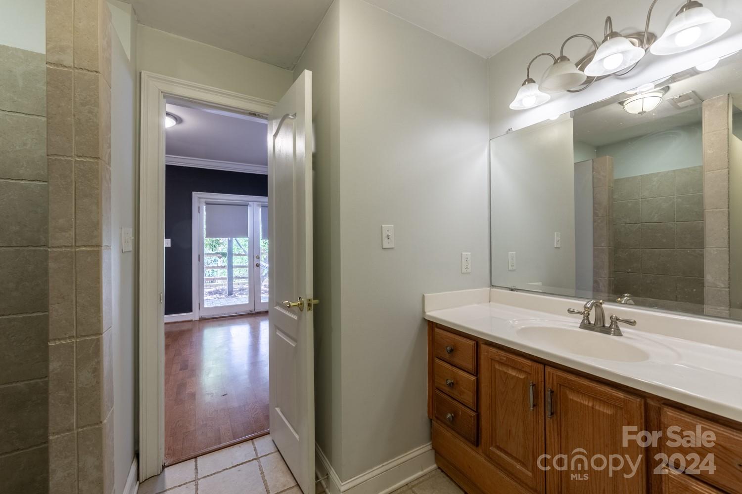 1177 Molokai Drive Tega Cay, SC 29708 - Photo 15 of 41 a bathroom with a sink vanity and a mirror