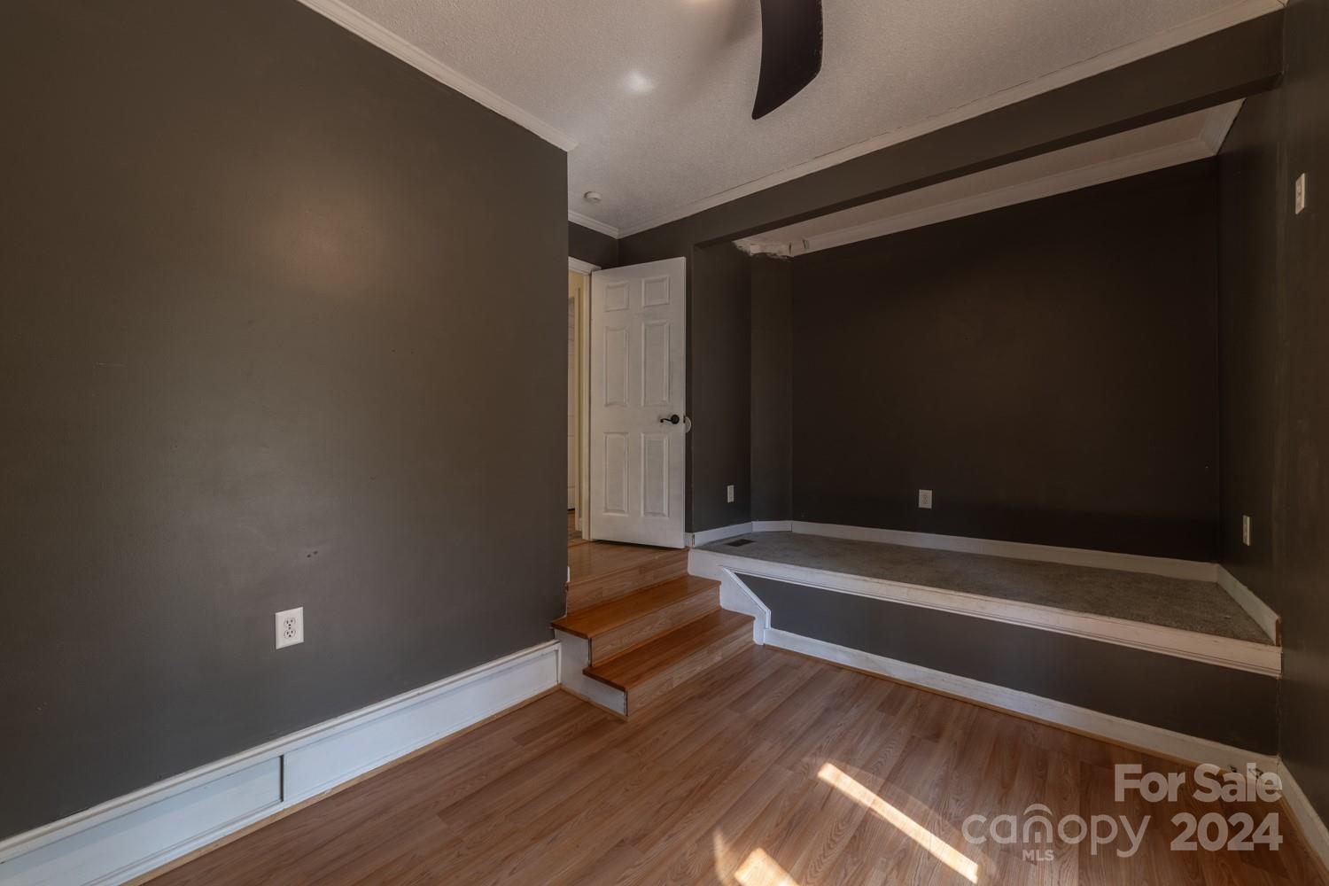 1177 Molokai Drive Tega Cay, SC 29708 - Photo 17 of 41 a view of room with wooden floor and bench
