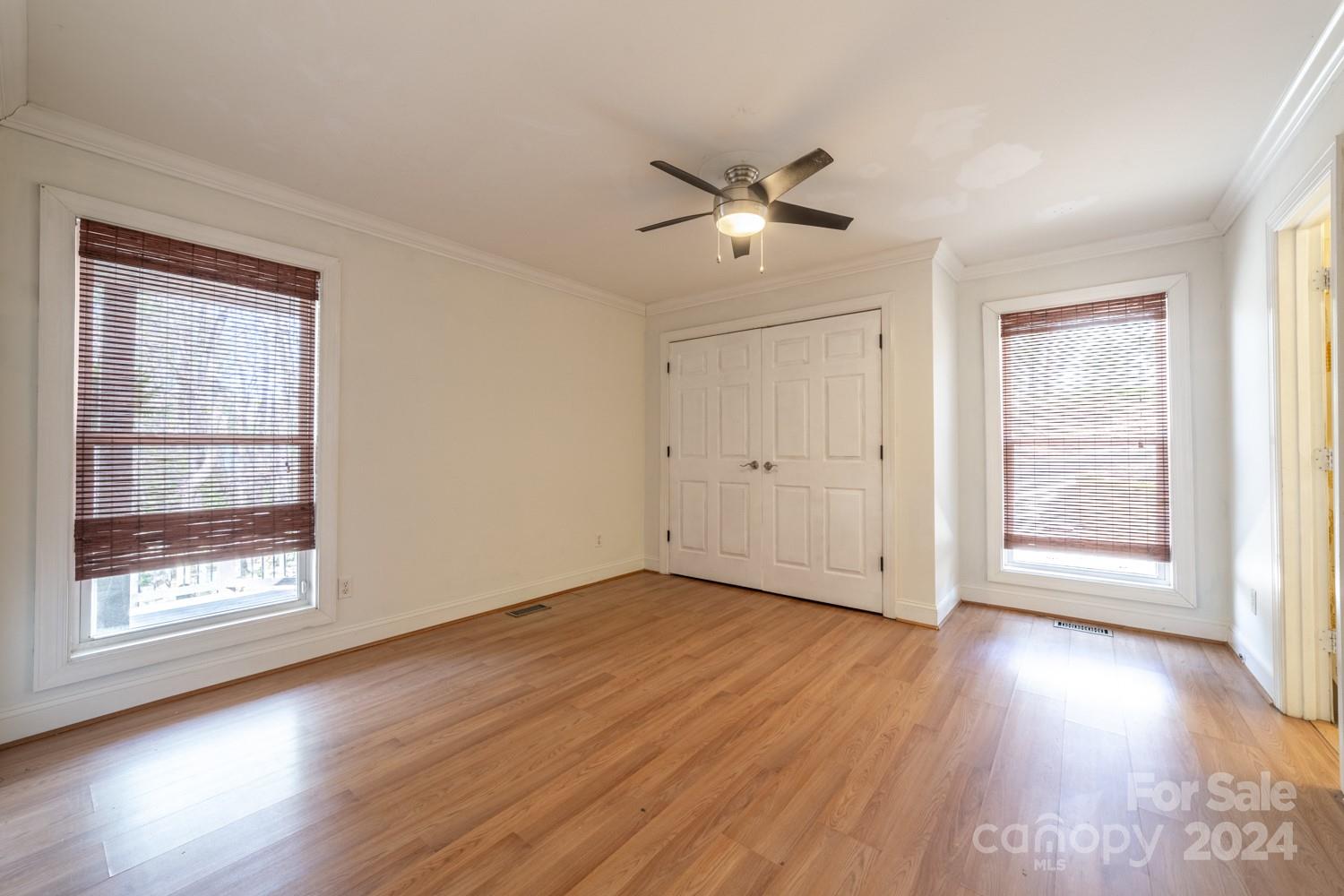 1177 Molokai Drive Tega Cay, SC 29708 - Photo 18 of 41 wooden floor in an empty room with a window