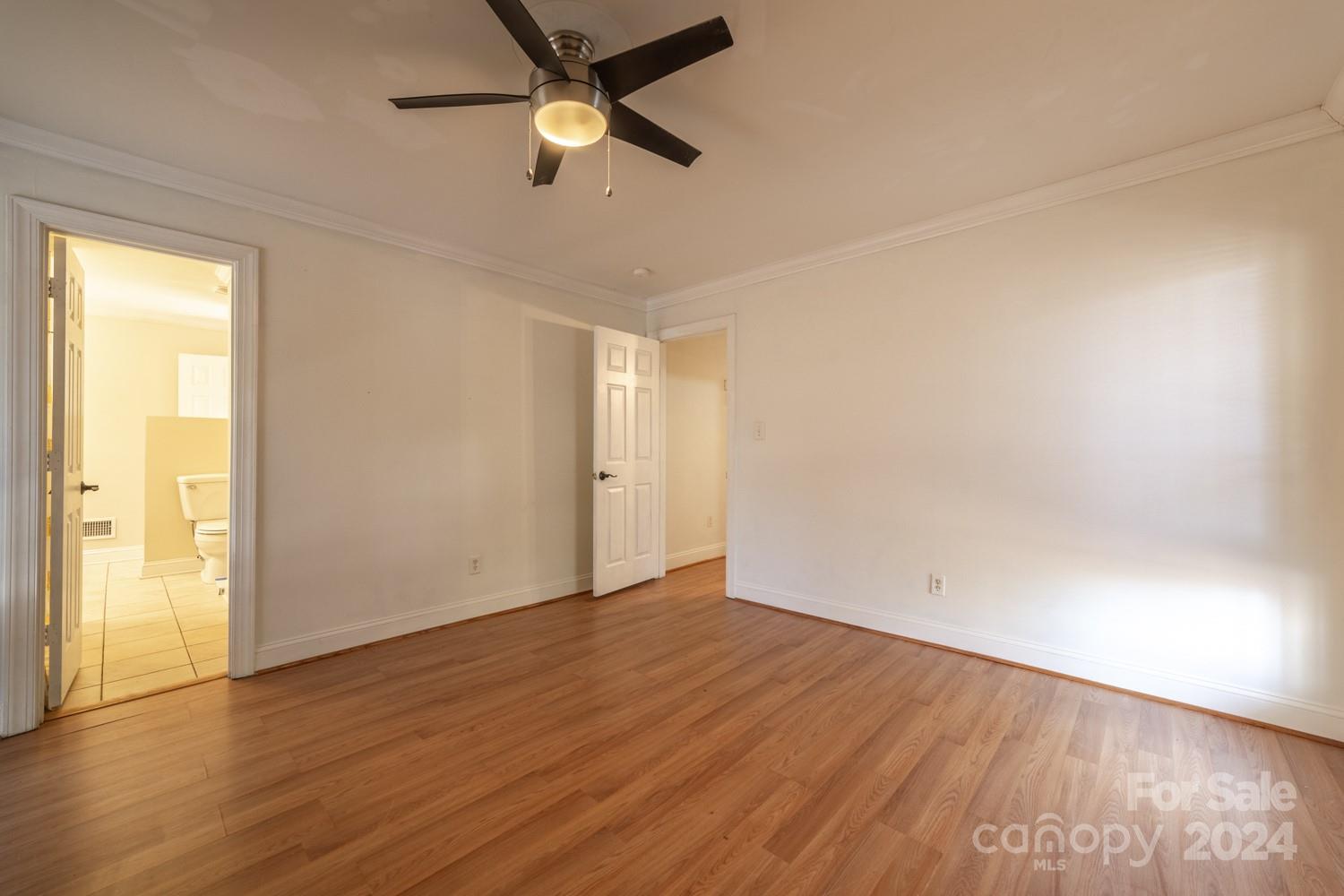 1177 Molokai Drive Tega Cay, SC 29708 - Photo 19 of 41 an empty room with wooden floor and windows