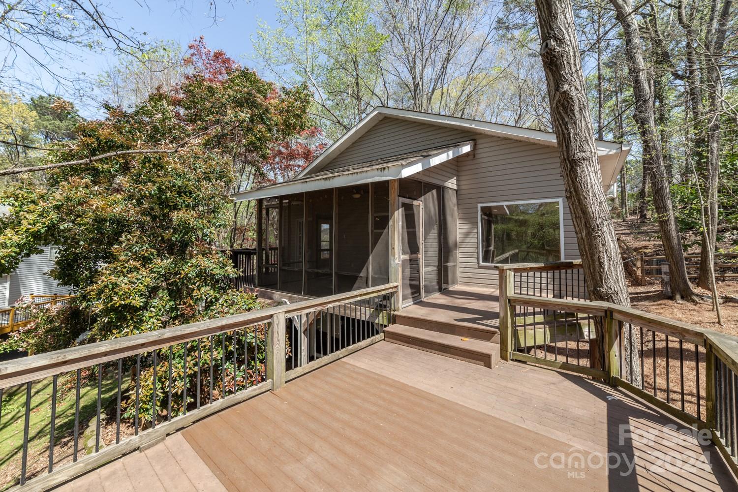 1177 Molokai Drive Tega Cay, SC 29708 - Photo 3 of 41 a view of a balcony with wooden floor and fence