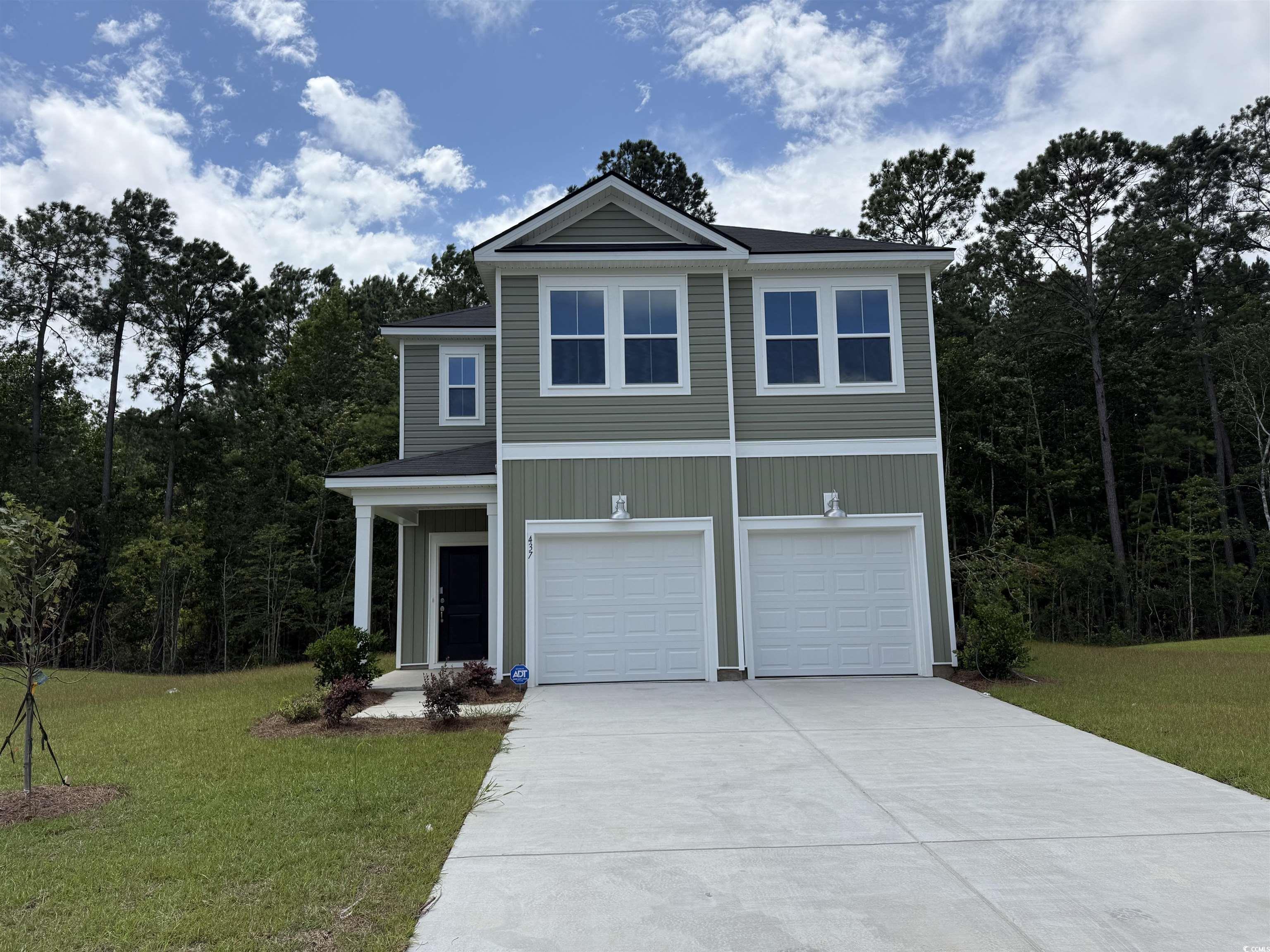 437 Falling Leaf Loop Myrtle Beach, SC 29588 - Photo 1 of 19 View of front of house with concrete driveway, a f