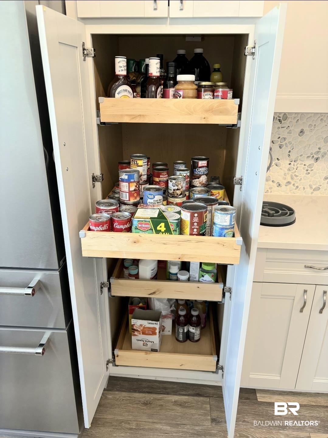141 Mark Twain Loop Foley, AL 36535 - Photo 7 of 55 Pull out shelves in pantry and bottom cabinets.