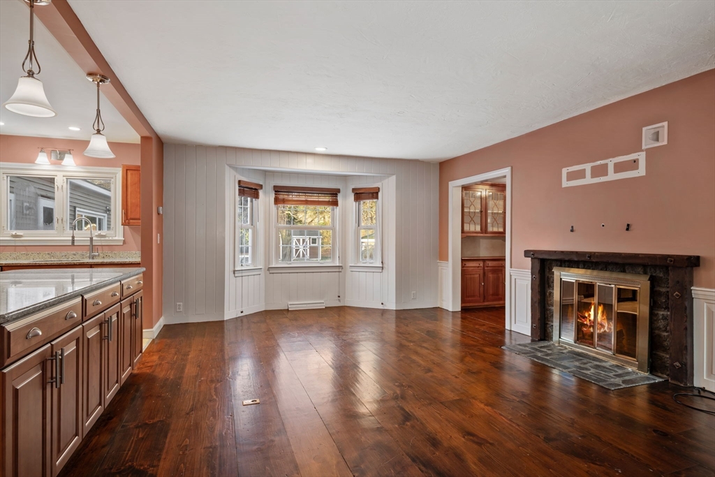 216 Boston Road Southborough, MA 01772 - Photo 5 of 30 a view of an empty room with wooden floor and a window