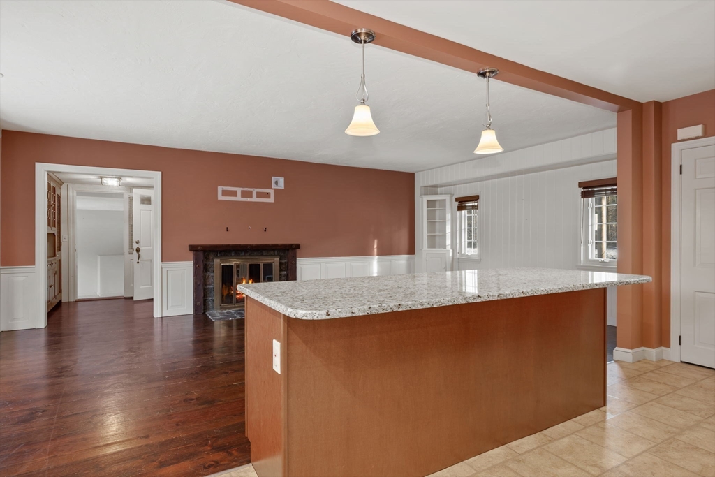 216 Boston Road Southborough, MA 01772 - Photo 6 of 30 a large kitchen with stainless steel appliances granite countertop a stove a sink and a refrigerator