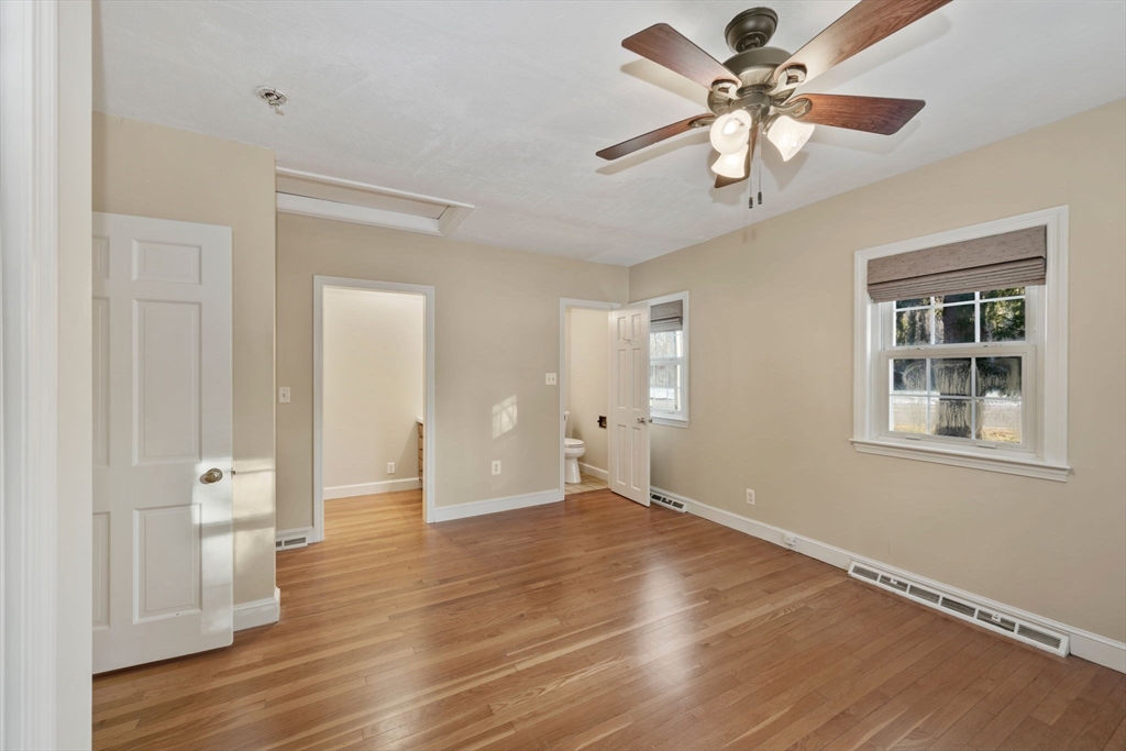 216 Boston Road Southborough, MA 01772 - Photo 8 of 30 a view of an empty room with a window and wooden floor