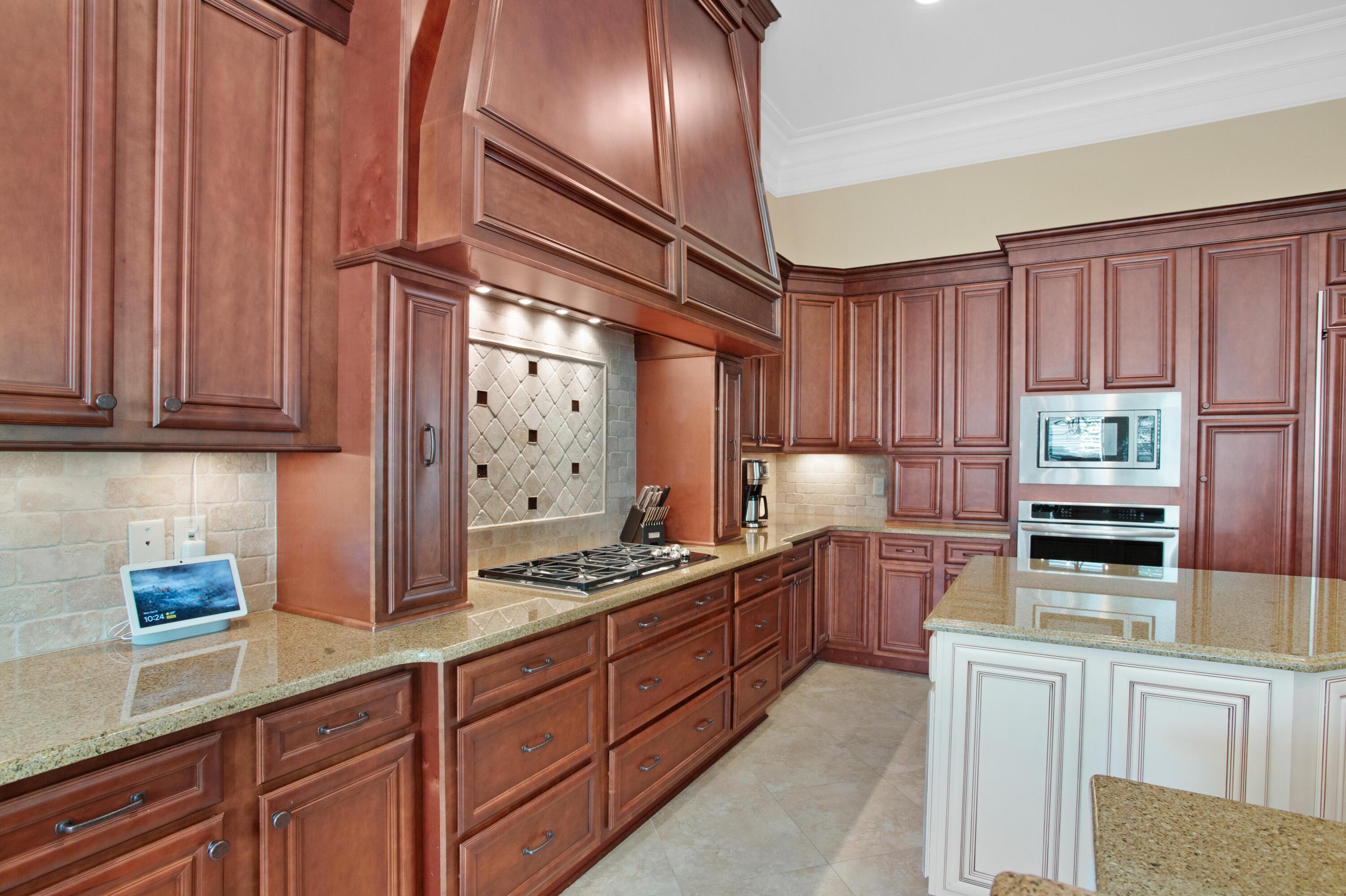 2946 Pine Valley Road Miramar Beach, FL 32550 - Photo 15 of 52 a kitchen with stainless steel appliances granite countertop a sink stove and cabinets