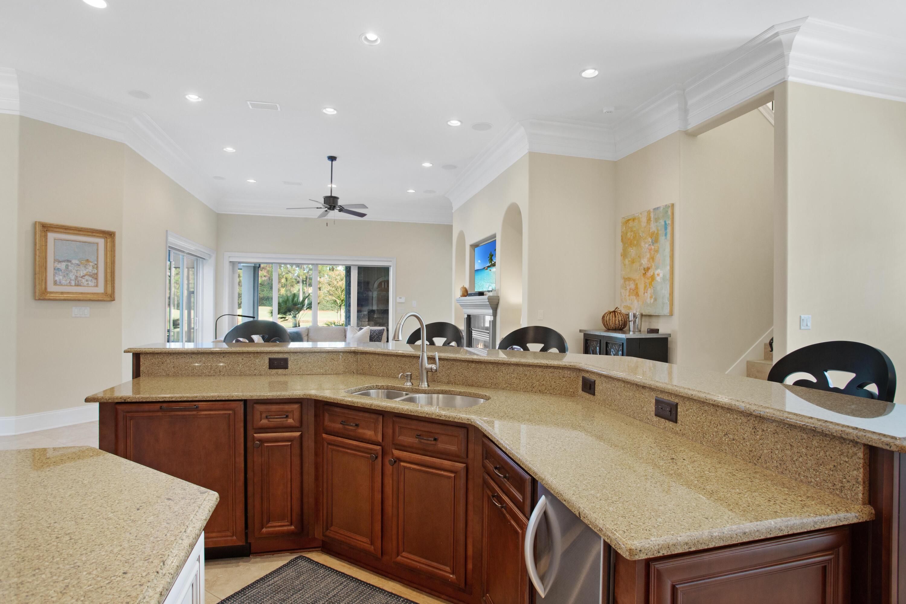 2946 Pine Valley Road Miramar Beach, FL 32550 - Photo 16 of 52 a kitchen with a sink a counter and cabinets
