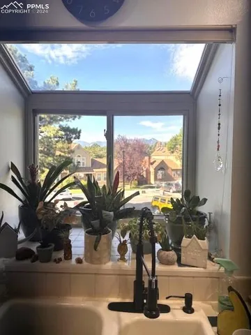 a view of living room with a large window