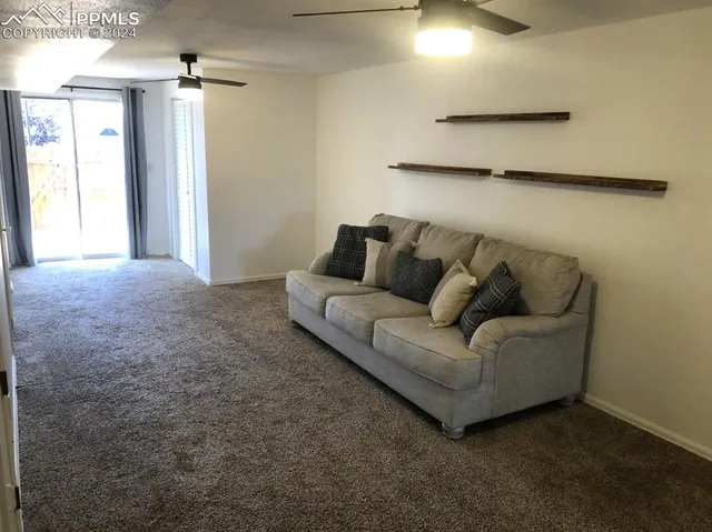 a living room with furniture and a window