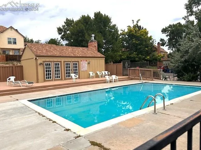 a view of a swimming pool with a patio