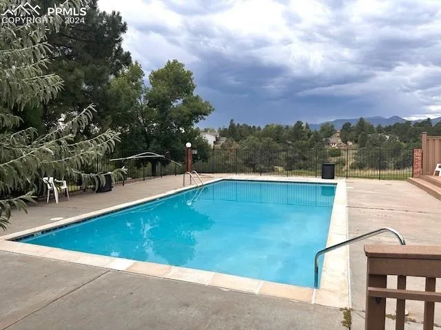 a view of swimming pool with a yard