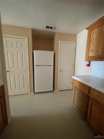 a view of storage and utility room with washer and dryer