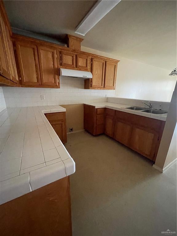 1006 Lilia Drive, Unit 73 Weslaco, TX 78599 - Photo 6 of 10 a kitchen with stainless steel appliances kitchen island sink refrigerator and stove