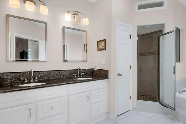 a white bath tub sitting next to a window