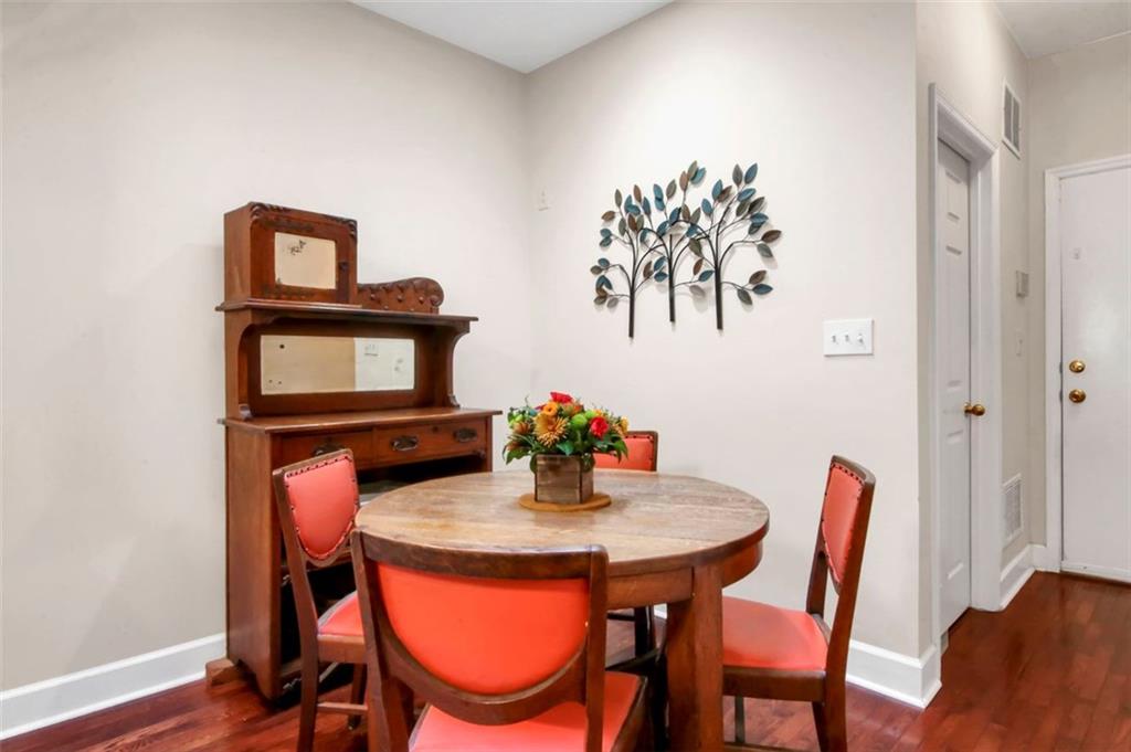 5364 Brooke Ridge Drive Dunwoody, GA 30338 - Photo 20 of 34 a view of a dining room with furniture and wooden floor