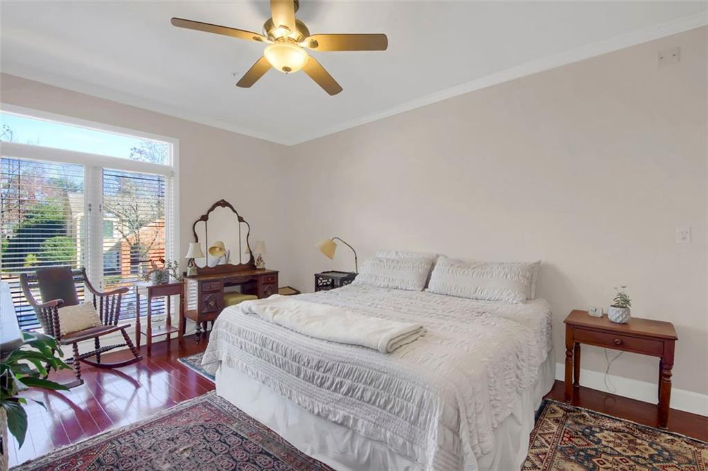 5364 Brooke Ridge Drive Dunwoody, GA 30338 - Photo 21 of 34 a bedroom with a bed a table and chair