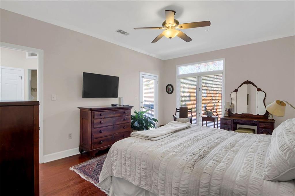 5364 Brooke Ridge Drive Dunwoody, GA 30338 - Photo 22 of 34 a bedroom with a bed and a flat screen tv