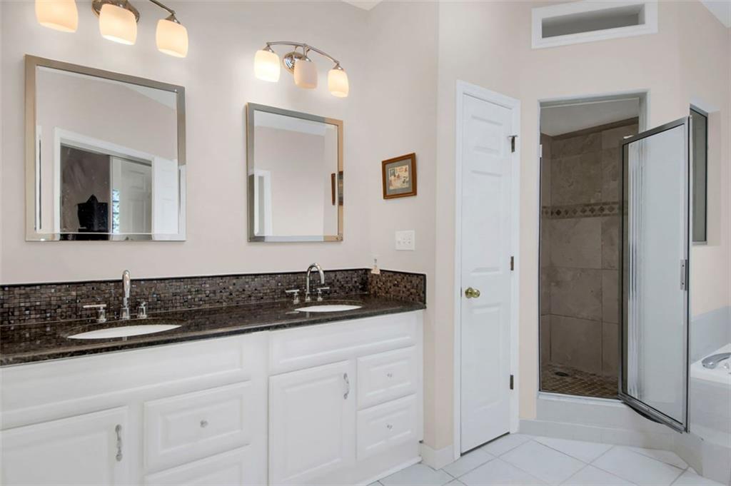 5364 Brooke Ridge Drive Dunwoody, GA 30338 - Photo 26 of 34 a bathroom with a sink and a mirror