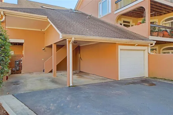 a front view of a residential houses with yard