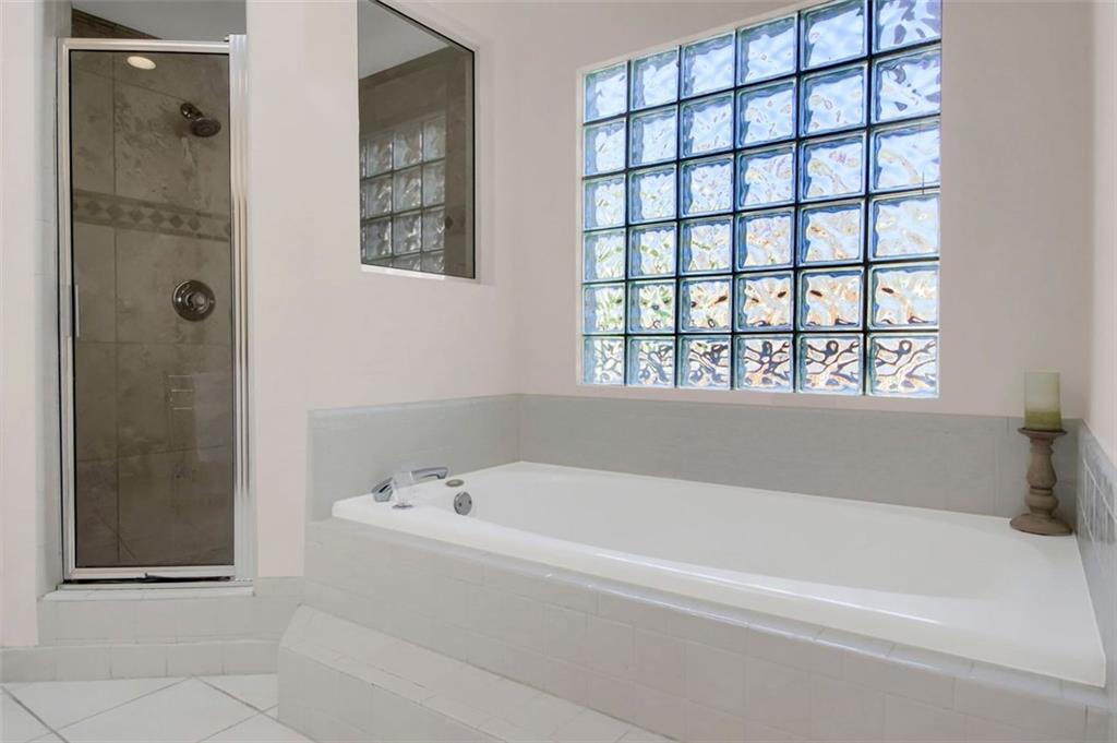 5364 Brooke Ridge Drive Dunwoody, GA 30338 - Photo 27 of 34 a white bath tub sitting next to a window