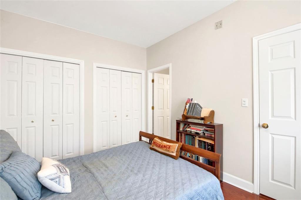 5364 Brooke Ridge Drive Dunwoody, GA 30338 - Photo 29 of 34 a bedroom with furniture and a book shelf