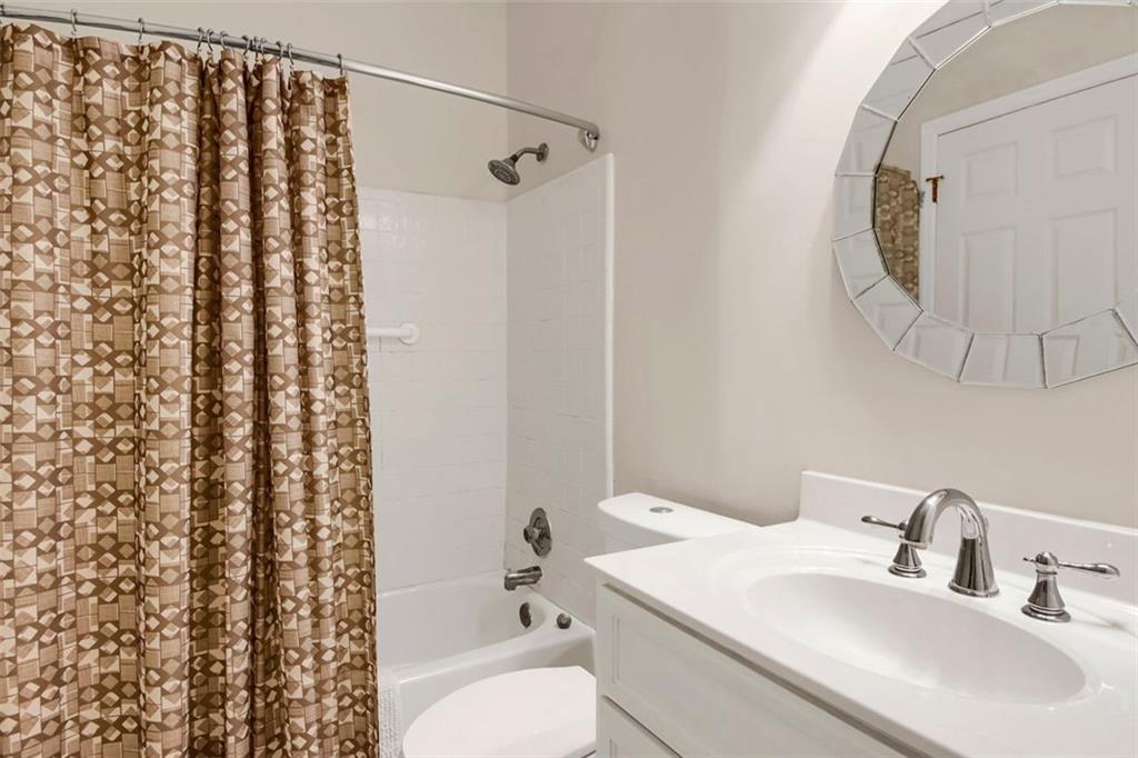 5364 Brooke Ridge Drive Dunwoody, GA 30338 - Photo 30 of 34 a bathroom with a sink toilet and shower