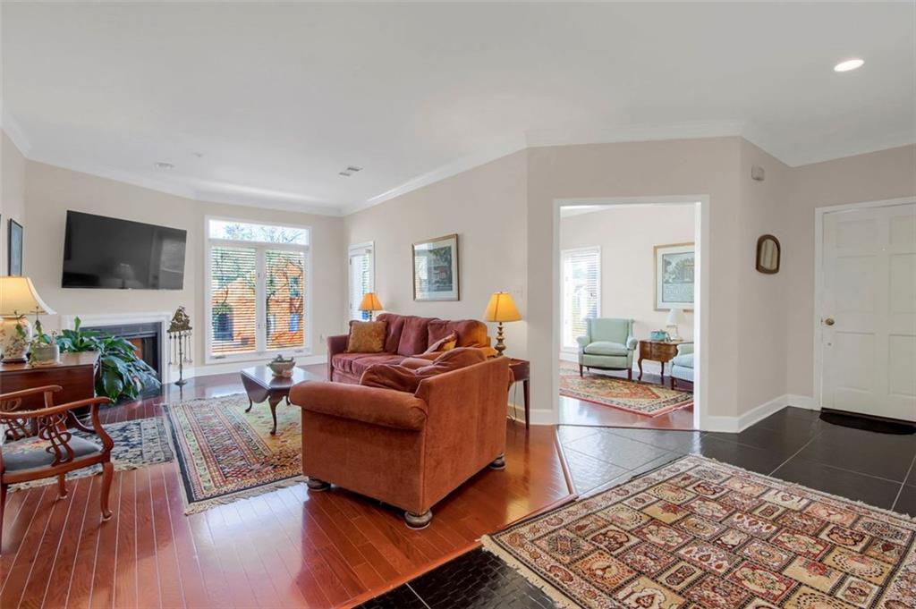5364 Brooke Ridge Drive Dunwoody, GA 30338 - Photo 7 of 34 a living room with furniture and a flat screen tv