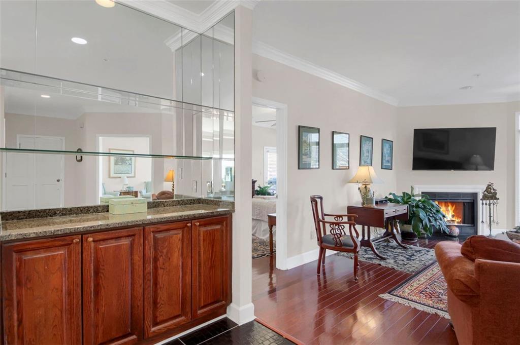5364 Brooke Ridge Drive Dunwoody, GA 30338 - Photo 8 of 34 a kitchen with granite countertop a table chairs microwave and sink