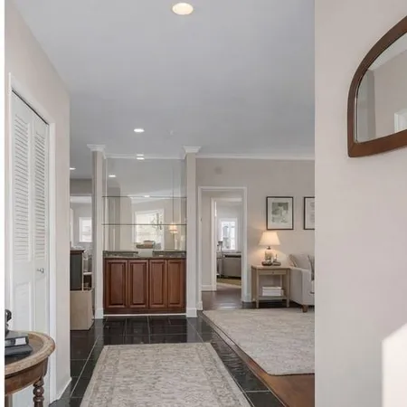 a living room with furniture and a table
