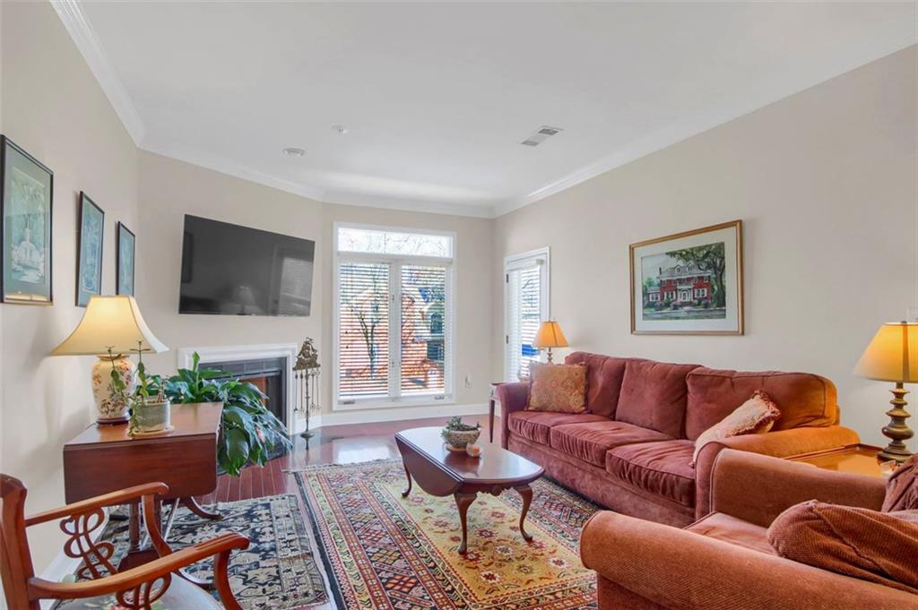 5364 Brooke Ridge Drive Dunwoody, GA 30338 - Photo 9 of 34 a living room with furniture a flat screen tv and a large window