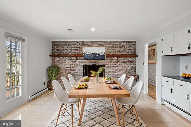 a bedroom with a bed chandelier and a window