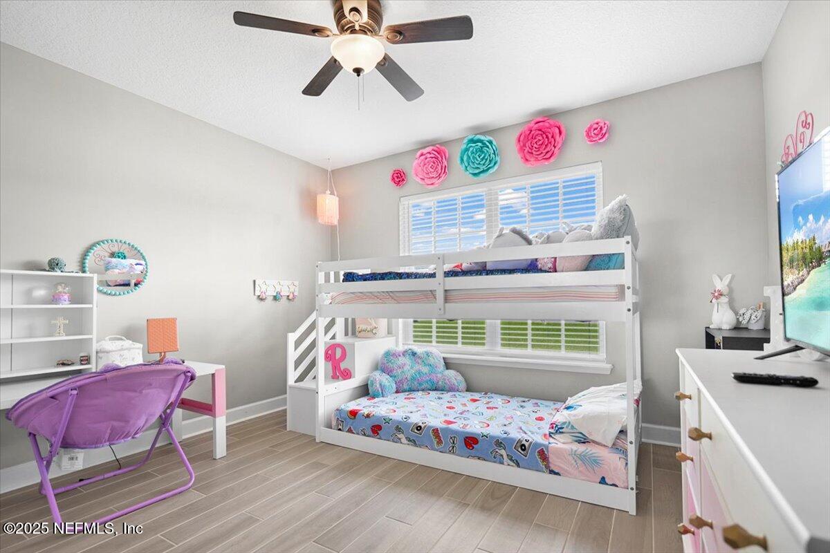 53347 Clear Lake Drive Callahan, FL 32011 - Photo 13 of 41 a bedroom with furniture and a window