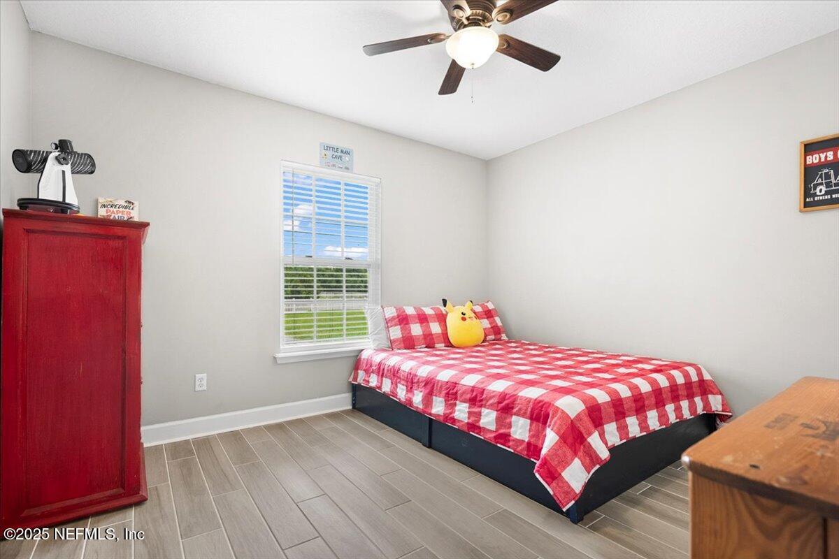 53347 Clear Lake Drive Callahan, FL 32011 - Photo 14 of 41 a bedroom with a bed and a window